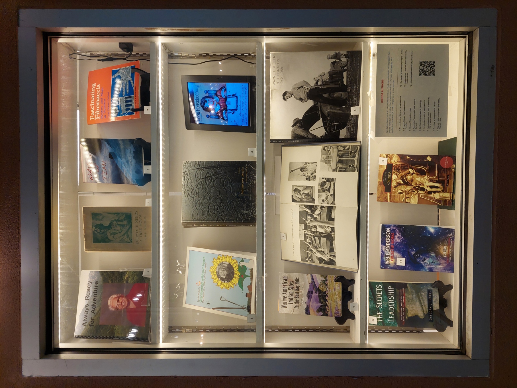 Window display at the Orinda History Museum featuring books by local Orinda authors